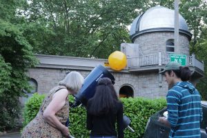 Dr. Larson and students at the Theodor Jacobsen Observatory