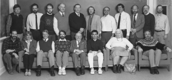 Department faculty in 1990. From left to right, sitting: Woody Sullivan, Paula Szkody, George Nelson, Scott Anderson, Theodor Jacobsen, Alberto Noriega-Crespo, Erika Bohm-Vitense, and Paul Boynton. Standing: Don Brownlee, George Lake, Jeffery Brown, Karl-Heinz Bohm, Paul Hodge, William Waller, Bruce Balick, Bruce Margon, George Wallerstein, John Deeter and Douglas Brown