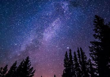 Purple-blue starry night sky of the Milky Way